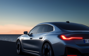 Silver sedan against sunset ocean backdrop, representing CNC turning applications for automotive parts like crankshafts and brake rotors requiring ±0.005mm tolerances.